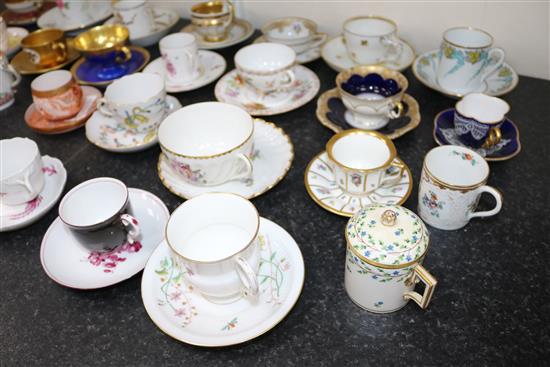 A collection of twenty eight Continental porcelain tea and coffee cups and saucers and four other cups, late 18th - early 20th century,
